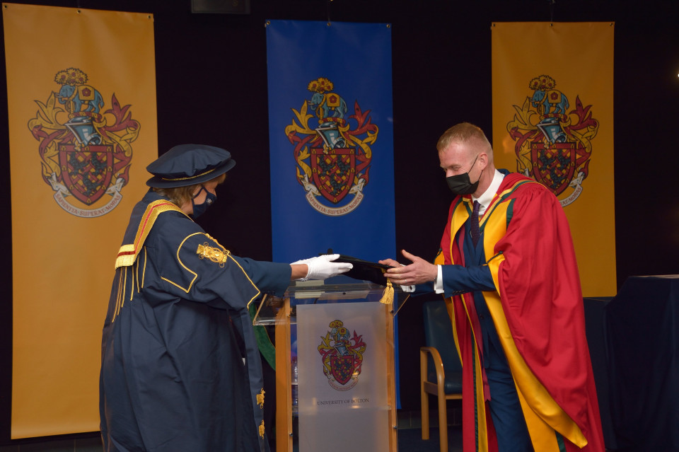 Bolton author “thrilled” as he receives Honorary Doctorate from home town University