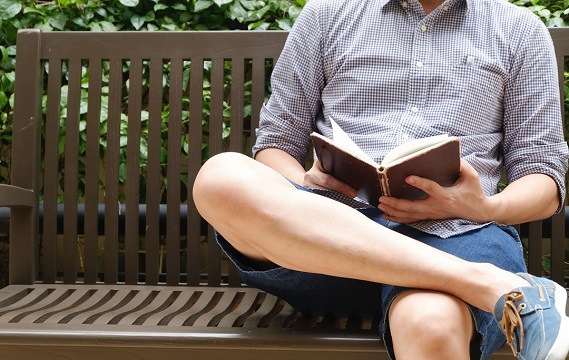 student guy reading bench2