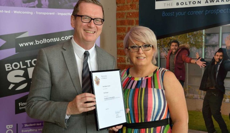  Assistant teaching professor Neil Dougan was presented with a certificate from the pro-vice-chancellor 