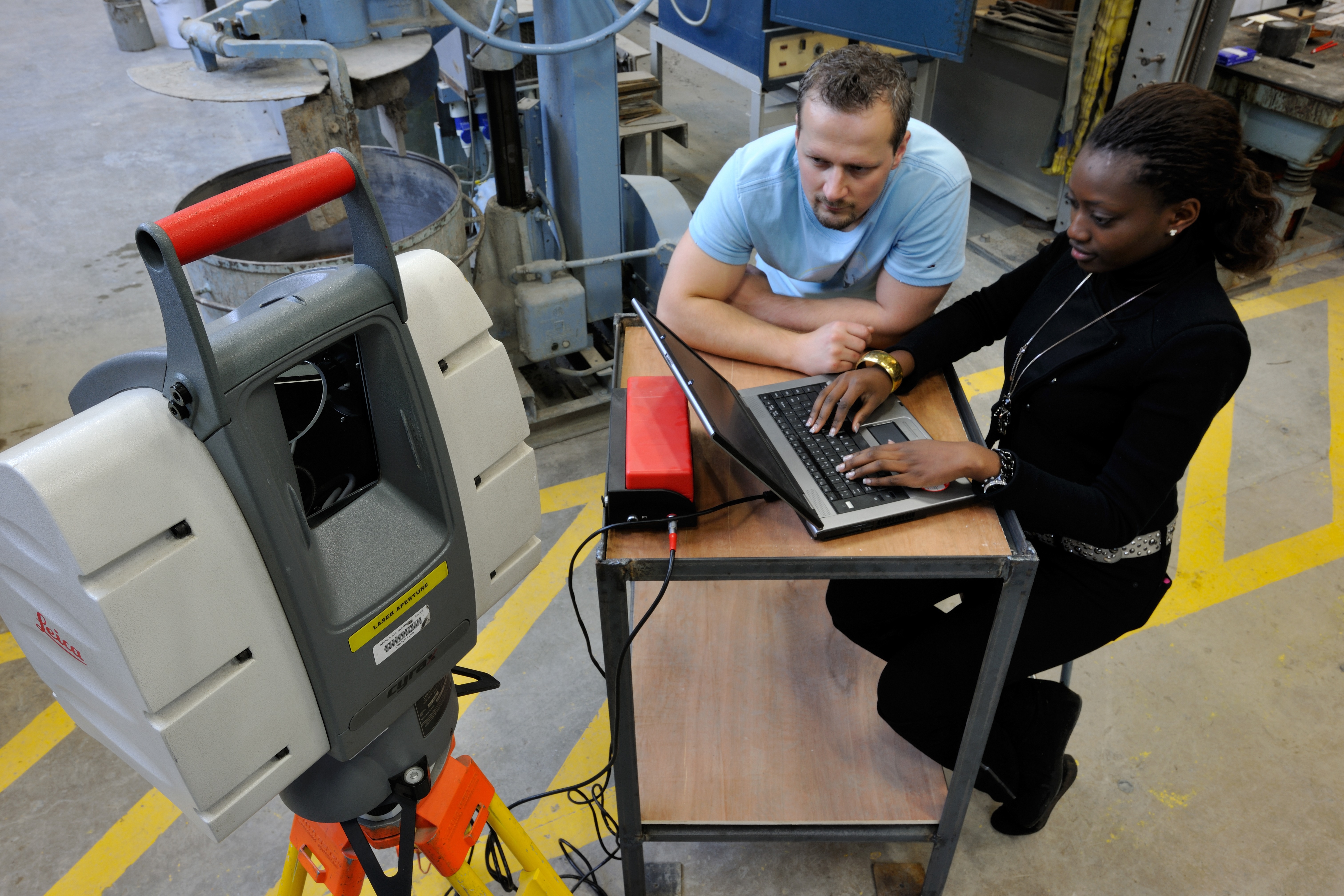 Built environment students using a laser scanner