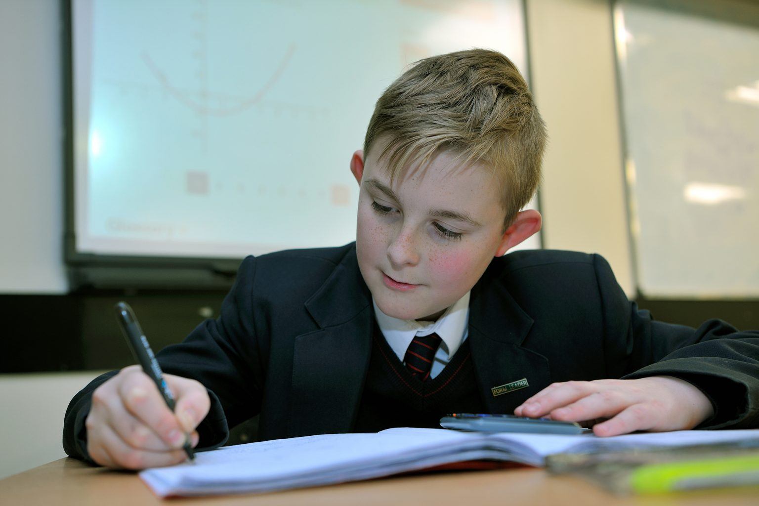 Secondary school student working on maths problems