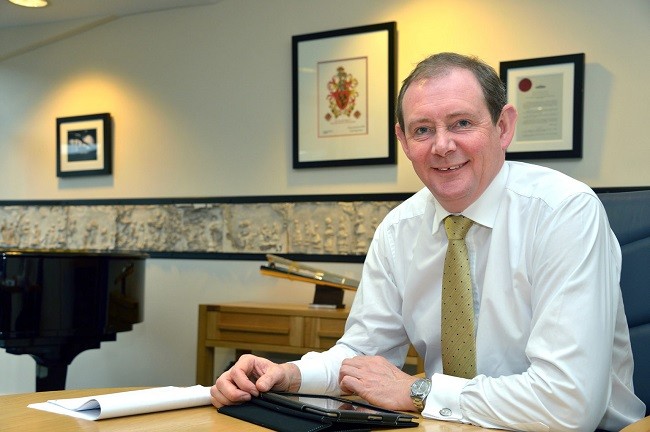 George Holmes at desk2