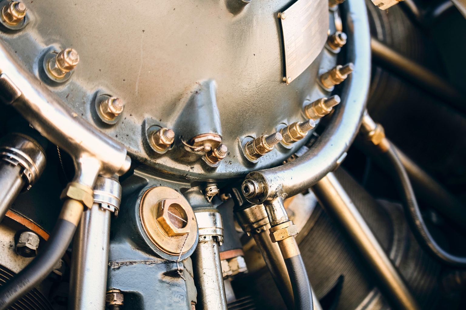 Close-up image of an aeroplane engine. Photo by Aaron Barnaby on Unsplash.