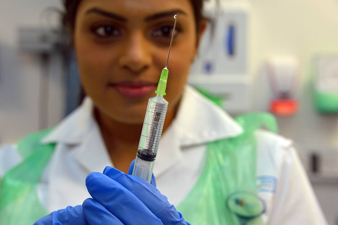 A University of Bolton Nursing and midwifery student with a hypodermic needle