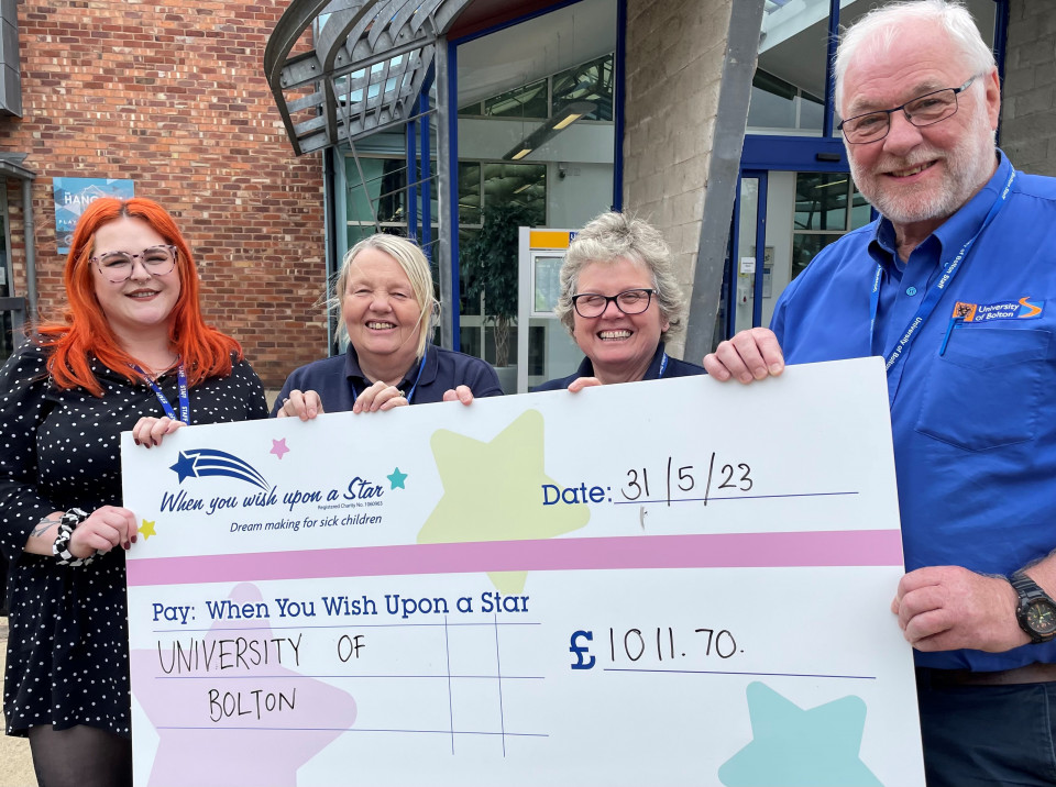 University of Bolton Facilities team presents £1,000 to children's charity