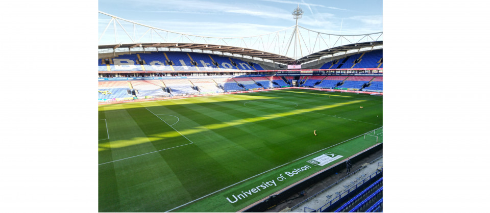 University of Bolton logos on hallowed turf as pitch sponsor for Bolton Wanderers Football Club